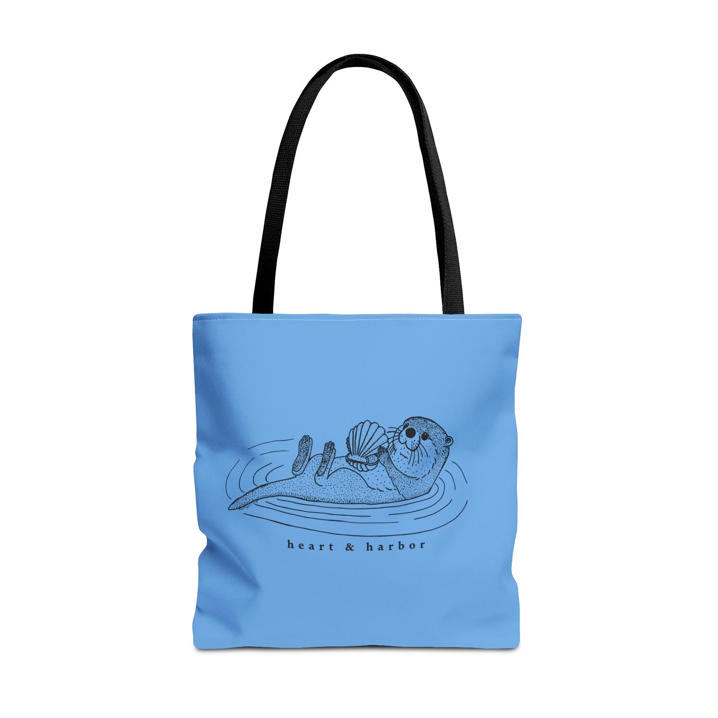 Blue tote bag with hand-drawn sea otter by heart & harbor