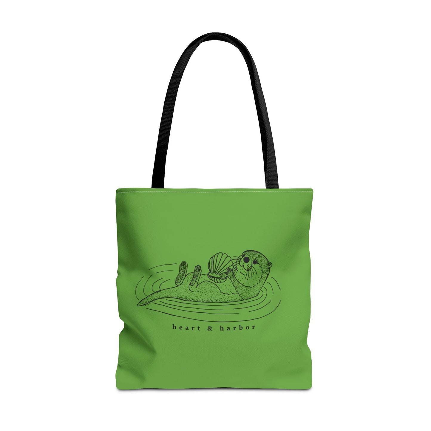 Green tote bag with hand-drawn sea otter by heart & harbor.