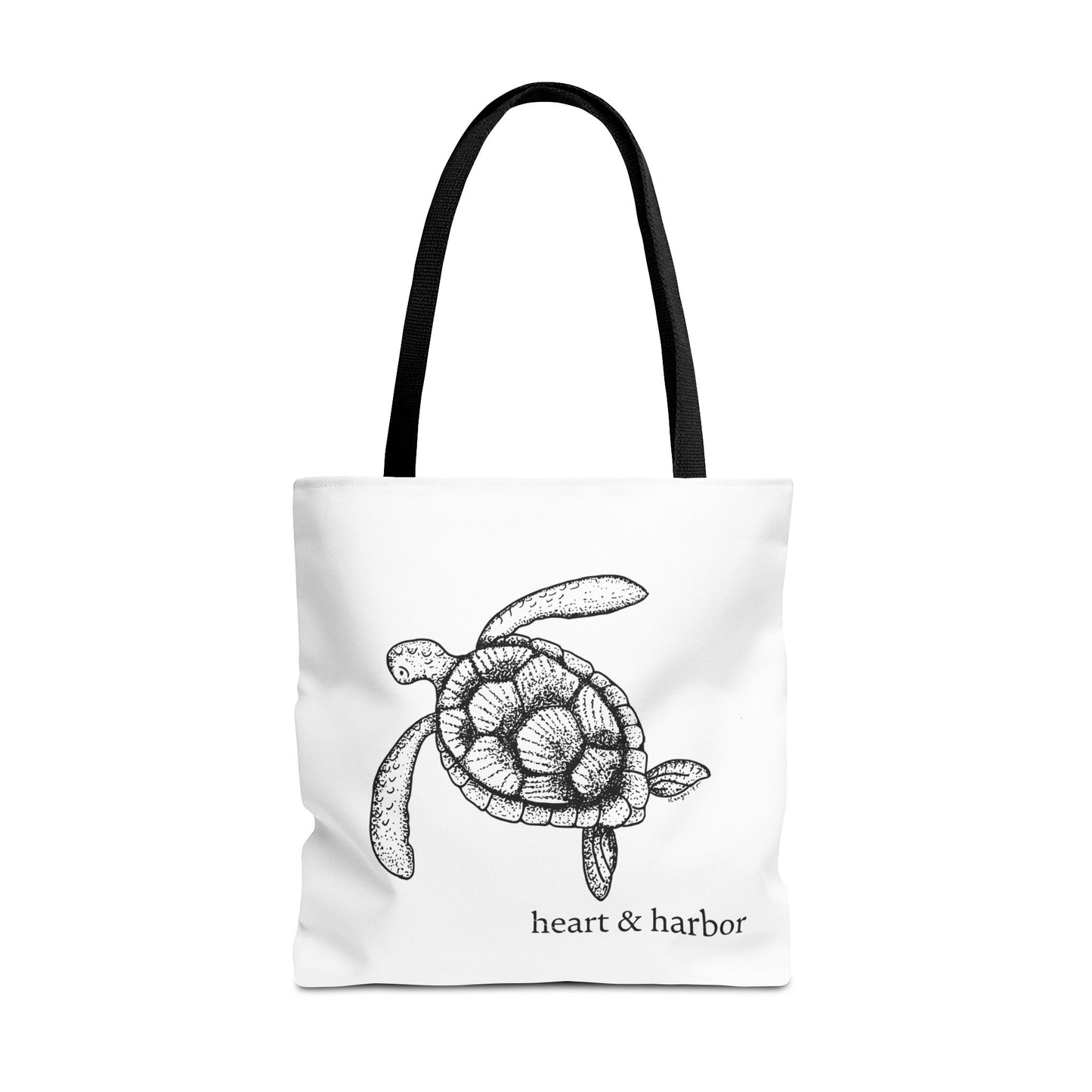 White tote bag with a hand-drawn sea turtle design by heart & harbor.