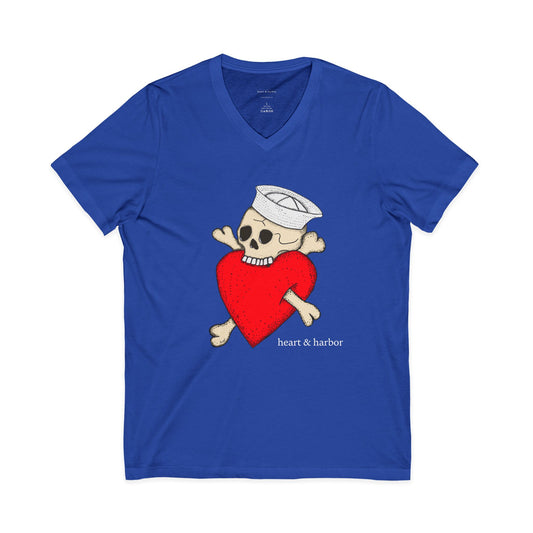 Blue t-shirt with a skull and crossbones design holding a red heart on a white background
