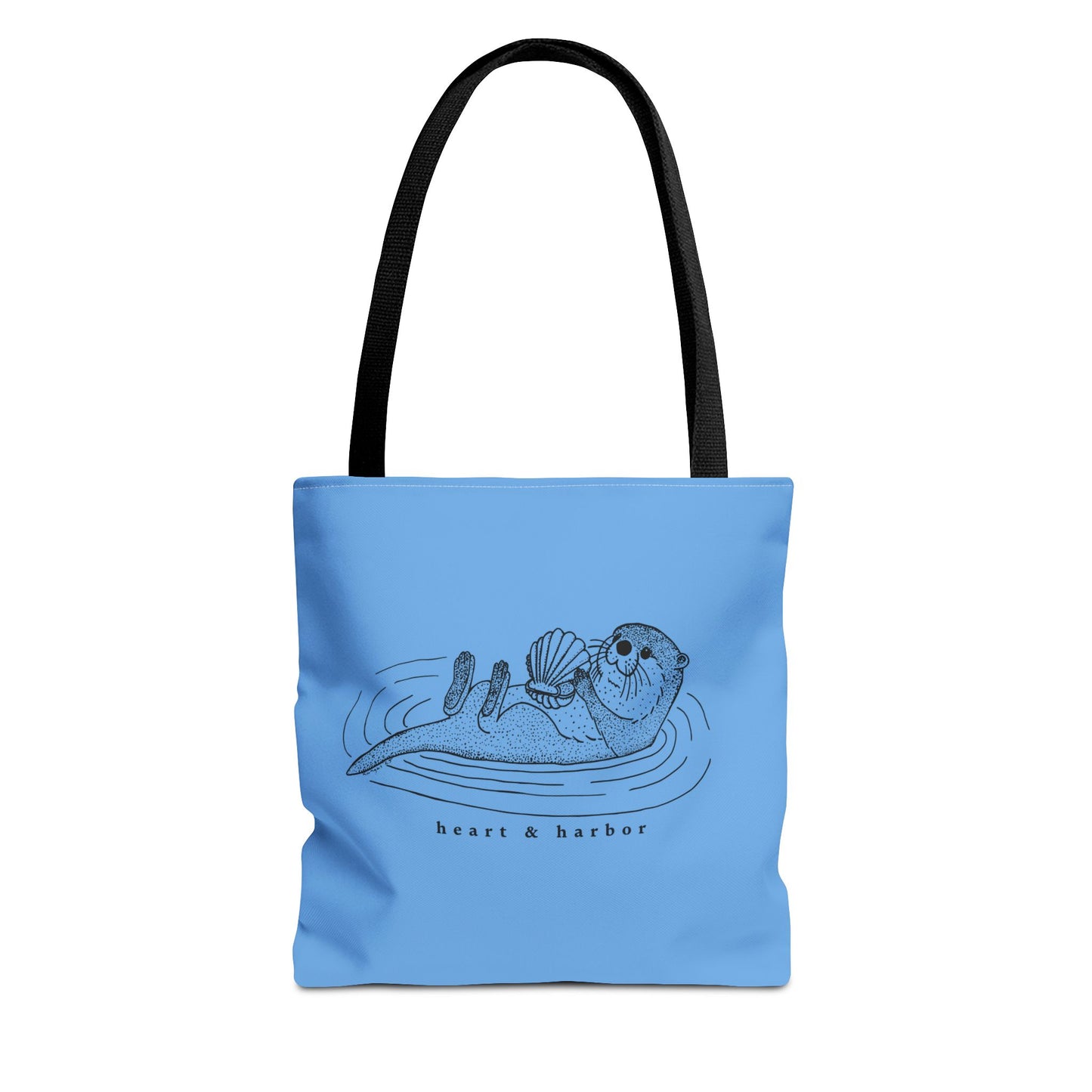 Blue tote bag with hand-drawn sea otter by heart & harbor
