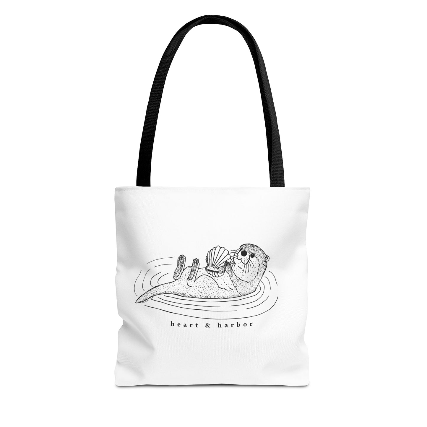 White tote bag with hand-drawn sea otter by heart & harbor.