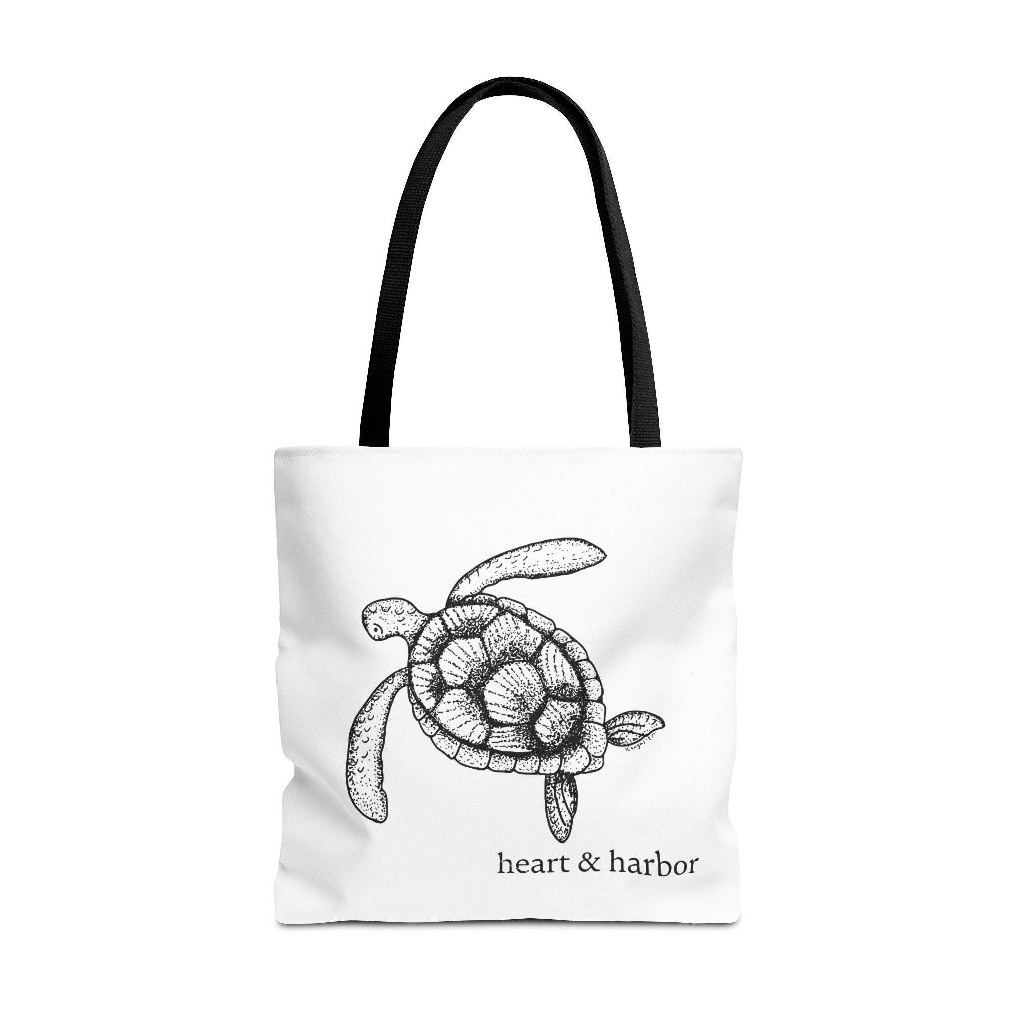 White tote bag with a hand-drawn sea turtle design by heart & harbor.