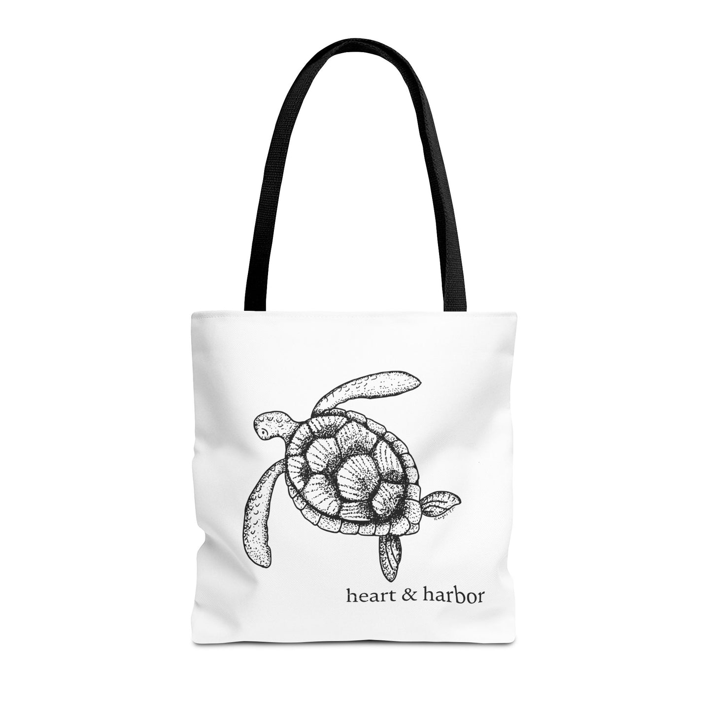 White tote bag with a hand-drawn sea turtle design by heart & harbor.