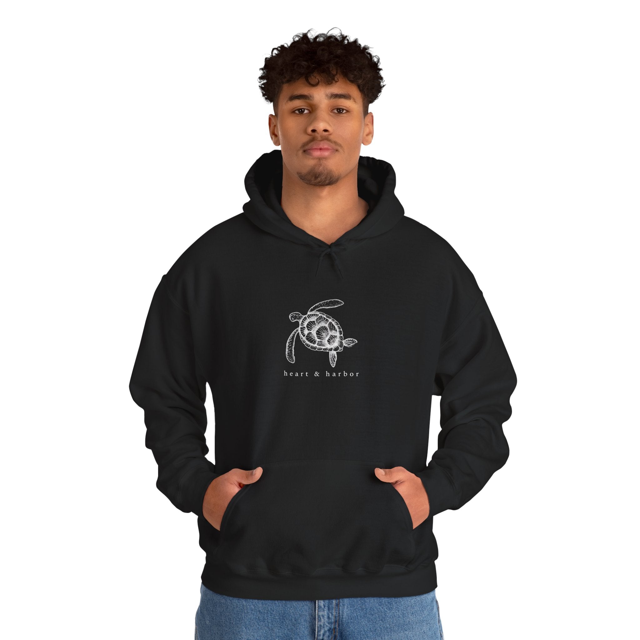 Black hand-drawn sea turtle hoodie with coastal Heart & Harbor artwork
