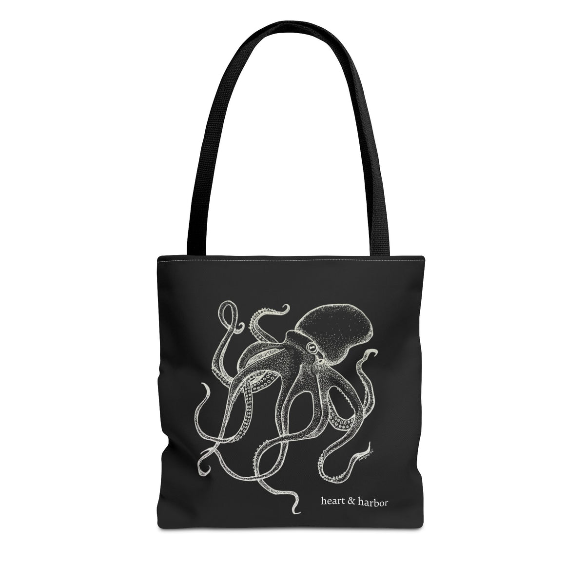 Black tote bag with black handles and original white Deep Octopus artwork by Heart & Harbor