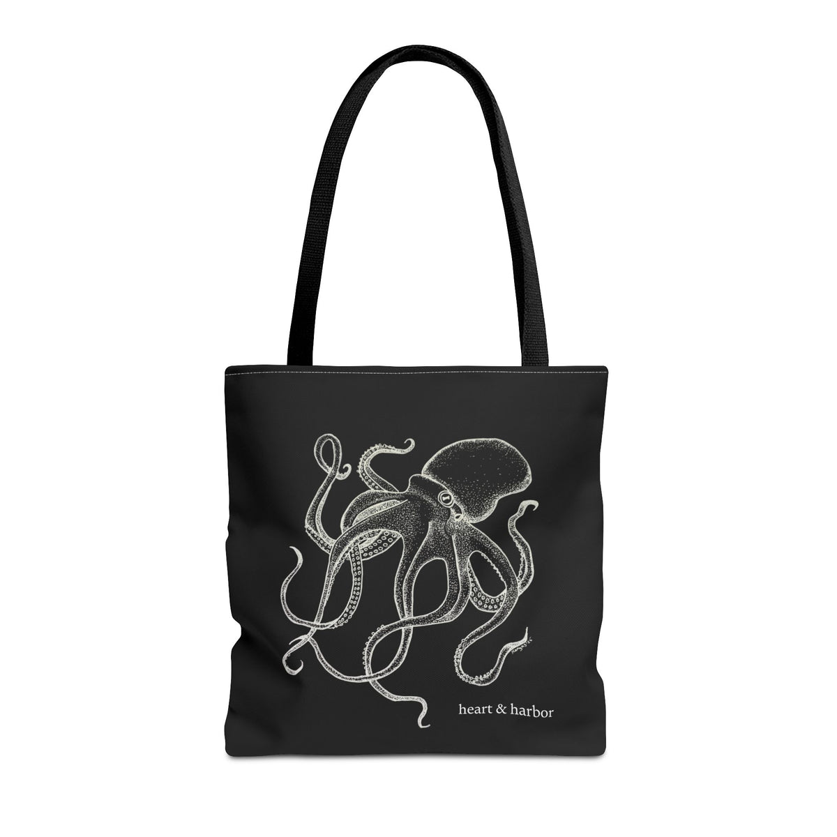 Black tote bag with black handles and original white Deep Octopus artwork by Heart & Harbor