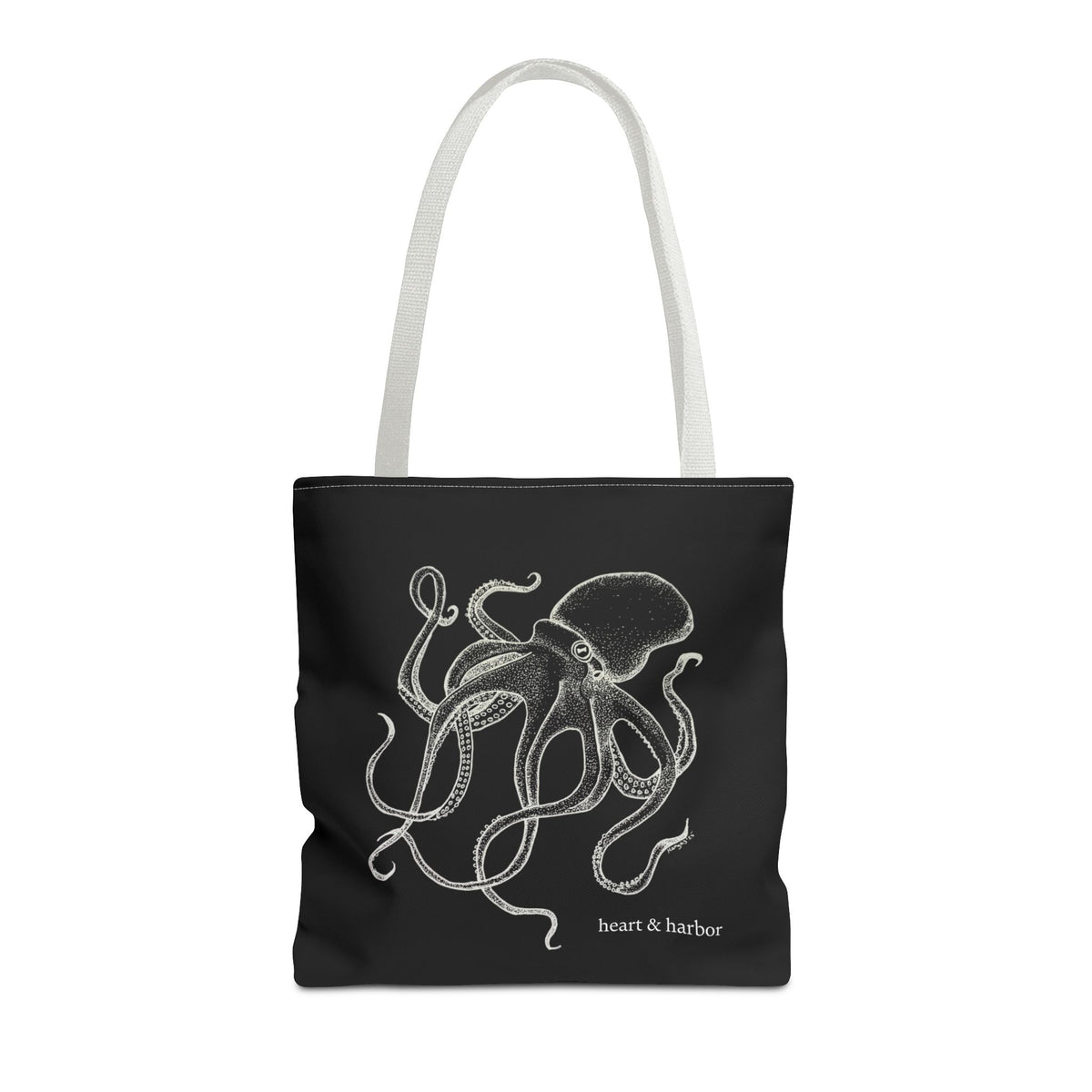 Black tote bag with white handles and original white Deep Octopus artwork by Heart & Harbor