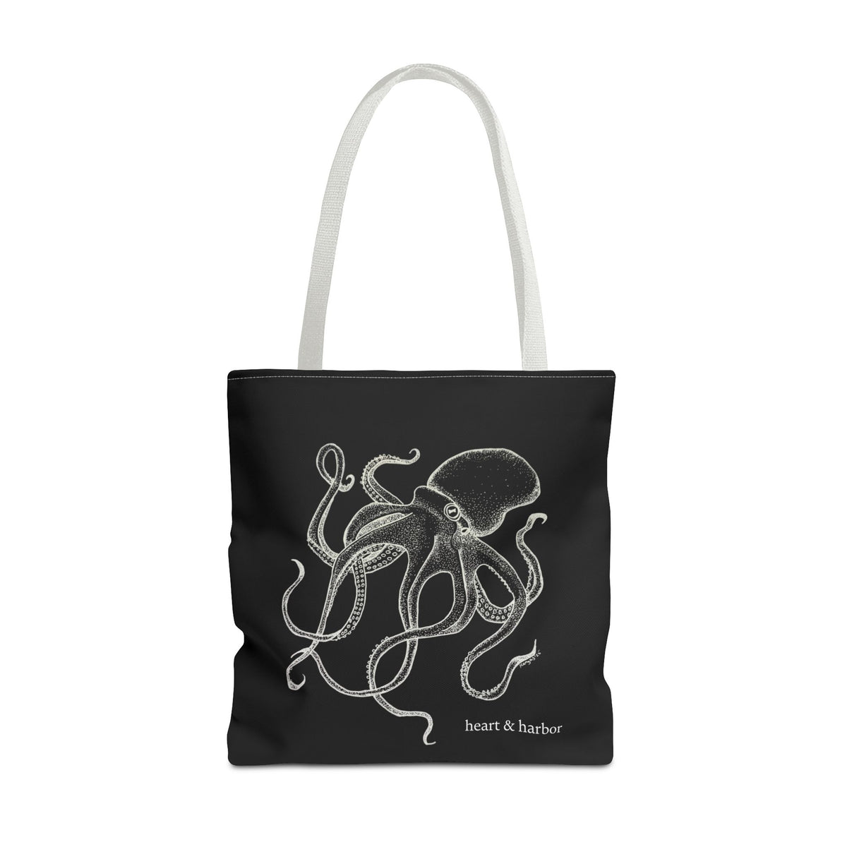 Black tote bag with white handles and original white Deep Octopus artwork by Heart & Harbor