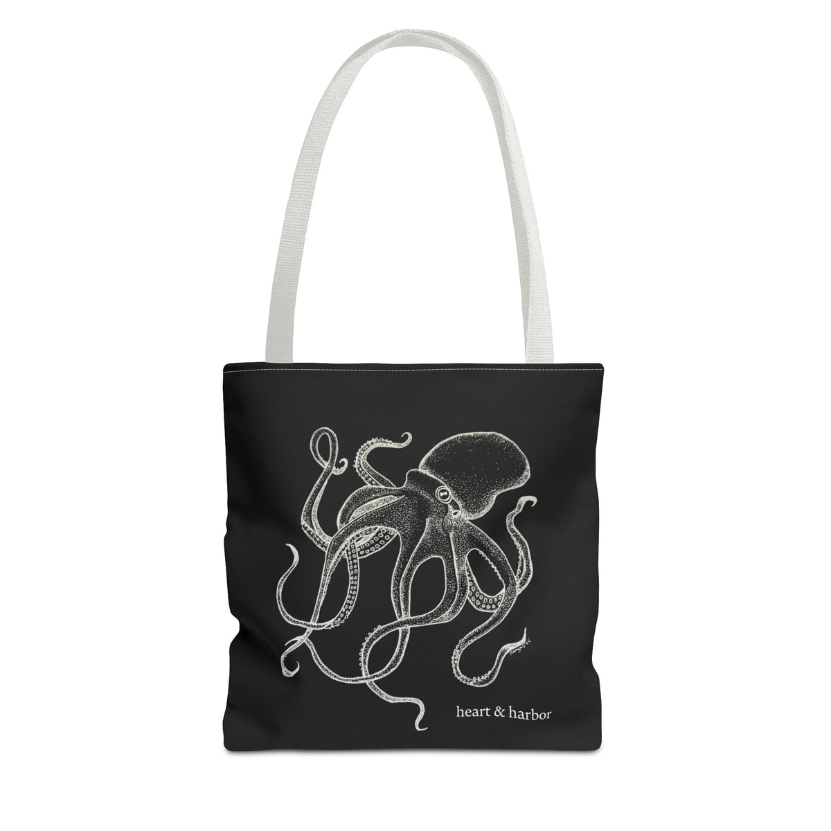 Black tote bag with white handles and original white Deep Octopus artwork by Heart & Harbor