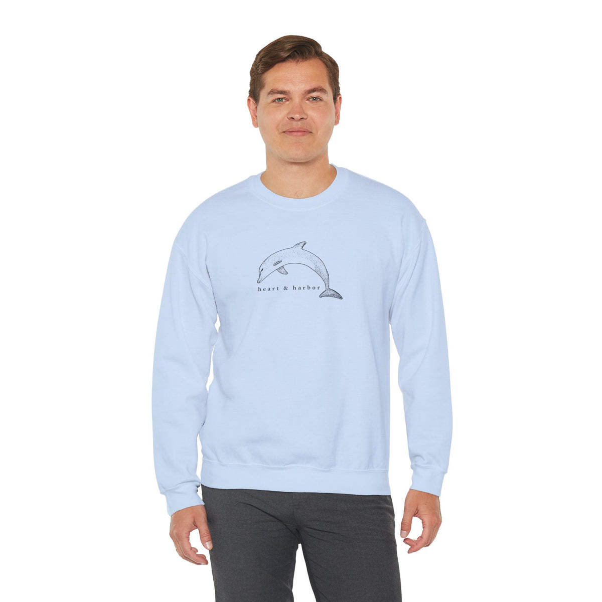 Light blue unisex crewneck sweatshirt with original hand-drawn Dolphin artwork by Heart & Harbor