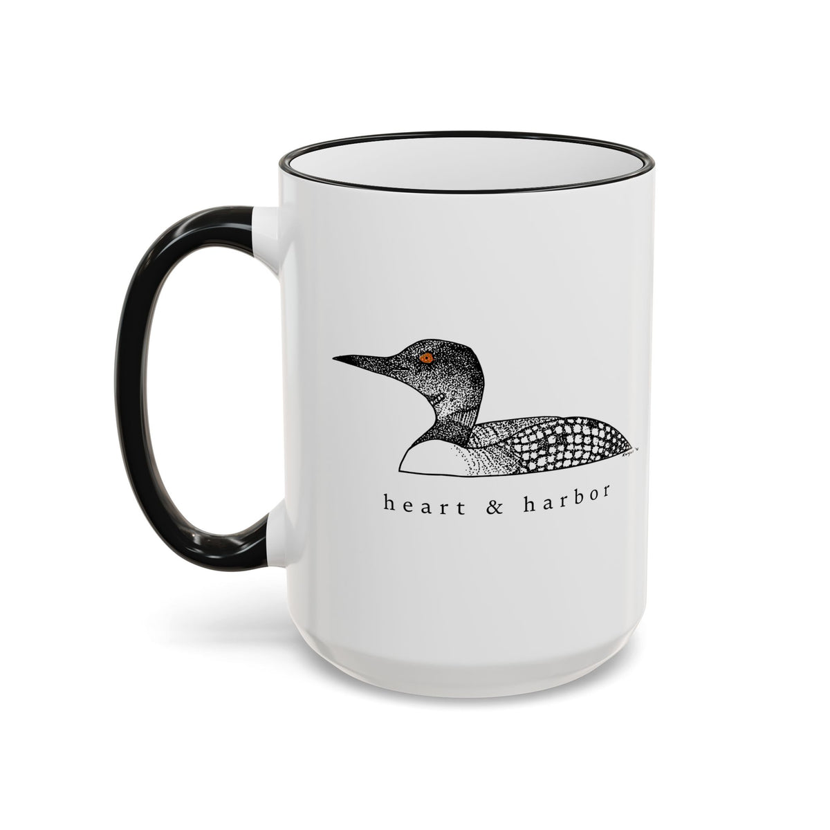 15 oz ceramic loon coffee mug with hand-drawn Heart & Harbor artwork and black rim and handle