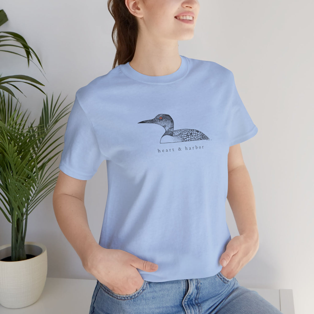 Unisex blue Bella+Canvas 3001 tee featuring original hand-drawn Heart & Harbor common loon artwork