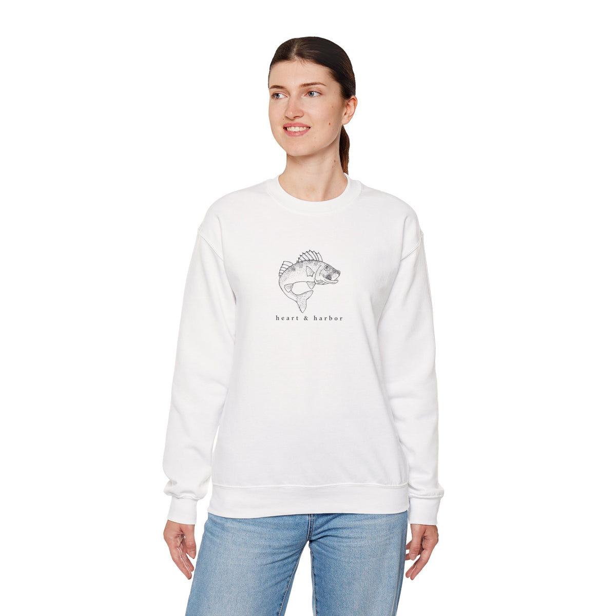 White unisex crewneck sweatshirt with original Heart & Harbor walleye artwork