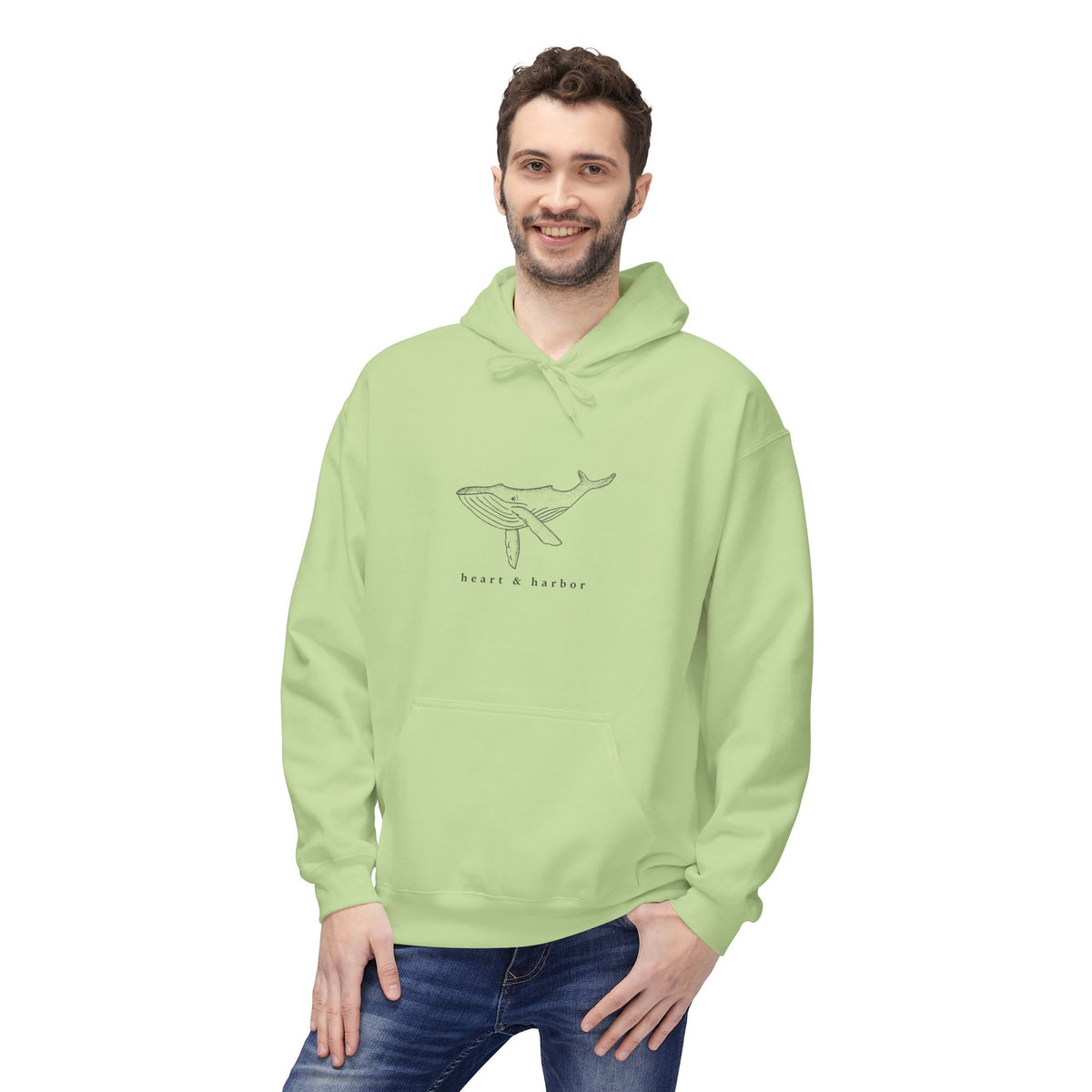 Pistachio green unisex hoodie with original hand-drawn coastal whale artwork